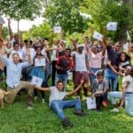 Group of young people smiling and holding certificates